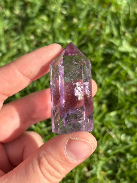 High Quality Amethyst Point ( slight chip tip )